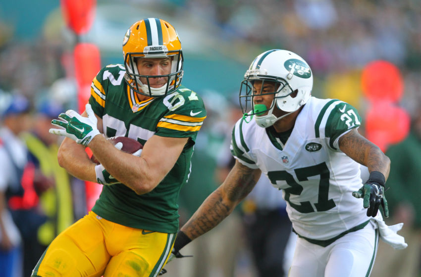 Sep 14, 2014; Green Bay, WI, USA; Green Bay Packers wide receiver Jordy Nelson (87) catches a 33 yard pass with New York Jets cornerback Dee Milliner (27) defending during the second half of a game at Lambeau Field. Green Bay won 31-24. Mandatory Credit: Dennis Wierzbicki-USA TODAY Sports