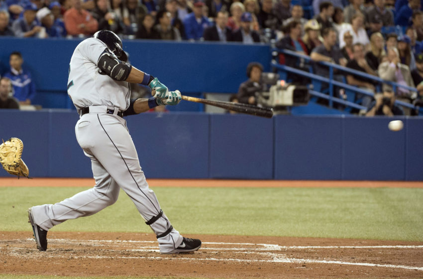 Sep 23, 2014; Toronto, Ontario, CAN; Seattle Mariners second baseman Robinson Cano (22) hits an RBI single during the third inning in a game against the Toronto Blue Jays at Rogers Centre. Mandatory Credit: Nick Turchiaro-USA TODAY Sports