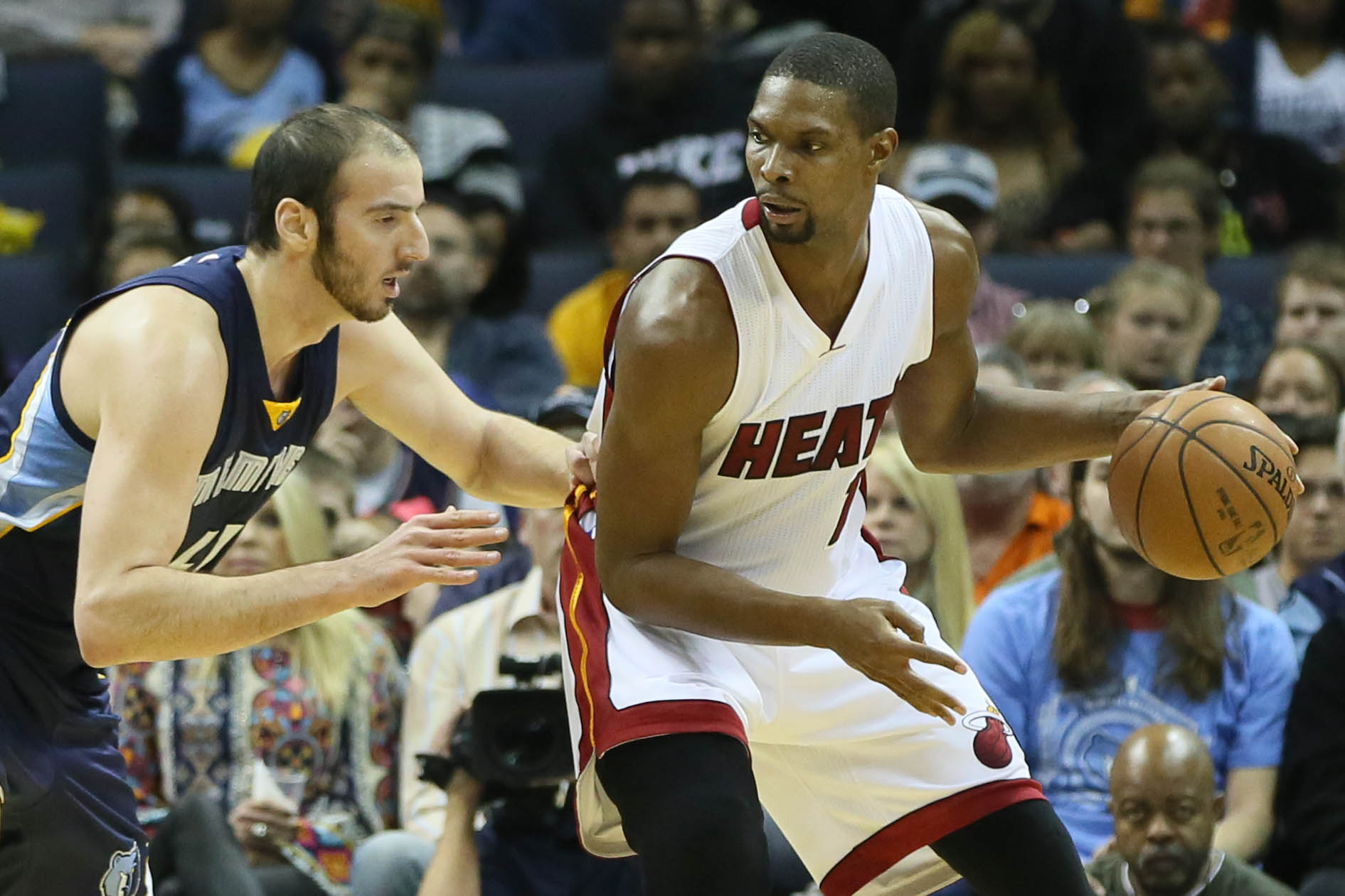 Dec 7, 2014; Memphis, TN, USA; Miami Heat forward Chris Bosh (1) backs in against Memphis Grizzlies center Kosta Koufus (41) in the first half at FedExForum. Mandatory Credit: Nelson Chenault-USA TODAY Sports