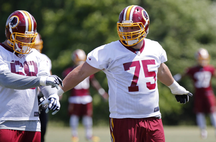 May 26, 2015; Ashbury, VA, USA; Washington Redskins offensive tackle Brandon Scherff (75) jokes with Redskins tackle Tom Compton (68) while participating in warm ups during the Redskins OTA at Redskins Park. Mandatory Credit: Geoff Burke-USA TODAY Sports