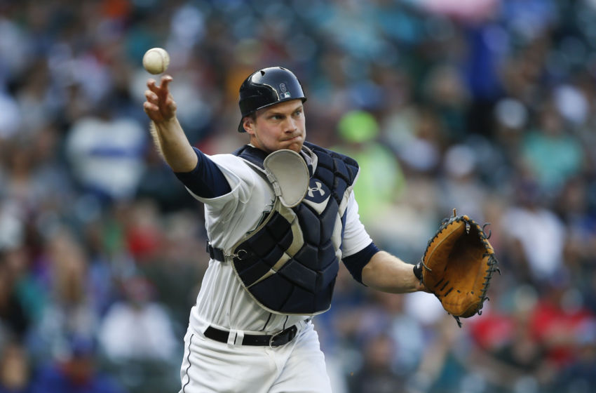Sep 7, 2015; Seattle, WA, USA; Seattle Mariners catcher John Hicks (6) throws to first for an out in the fifth inning against the Texas Rangers at Safeco Field. Texas won 3-0. Mandatory Credit: Jennifer Buchanan-USA TODAY Sports