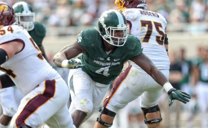 Sep 26, 2015; East Lansing, MI, USA; Michigan State Spartans defensive lineman Malik McDowell (4) breaks though the Central Michigan offensive line during the 2nd half of a game at Spartan Stadium. MSU won 30-10. Mandatory Credit: Mike Carter-USA TODAY Sports