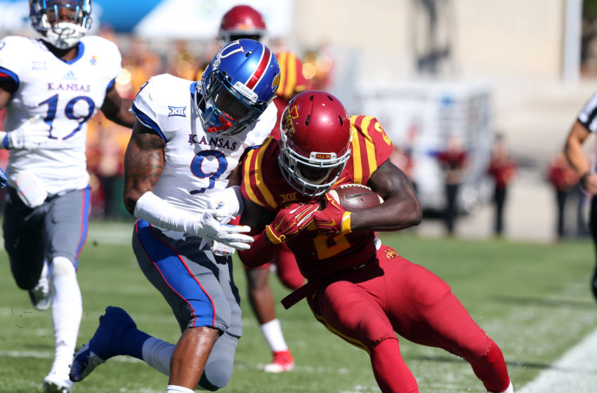 Oct 3, 2015; Ames, IA, USA; Iowa State Cyclones running back Mike Warren (2) is tackled by Kansas Jayhawks safety Fish Smithson (9) at Jack Trice Stadium. Mandatory Credit: Reese Strickland-USA TODAY Sports