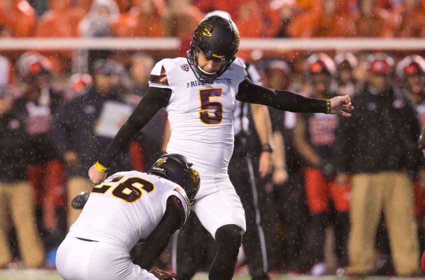 Oct 17, 2015; Salt Lake City, UT, USA; Arizona State Sun Devils place kicker Zane Gonzalez (5) kicks the ball as punter Matt Haack (26) holds during the second half against the Utah Utes at Rice-Eccles Stadium. Utah won 34-18. Mandatory Credit: Russ Isabella-USA TODAY Sports