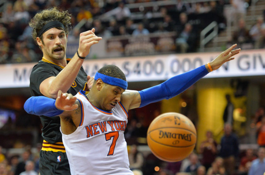 Nov 4, 2015; Cleveland, OH, USA; New York Knicks forward Carmelo Anthony (7) and Cleveland Cavaliers forward Kevin Love (0) battle for a rebound during a game at Quicken Loans Arena. Cleveland won 96-86. Mandatory Credit: David Richard-USA TODAY Sports