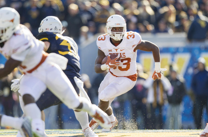 Nov 14, 2015; Morgantown, WV, USA; Texas Longhorns running back D'Onta Foreman runs the ball during the third quarter against the West Virginia Mountaineers at Milan Puskar Stadium. Mandatory Credit: Ben Queen-USA TODAY Sports