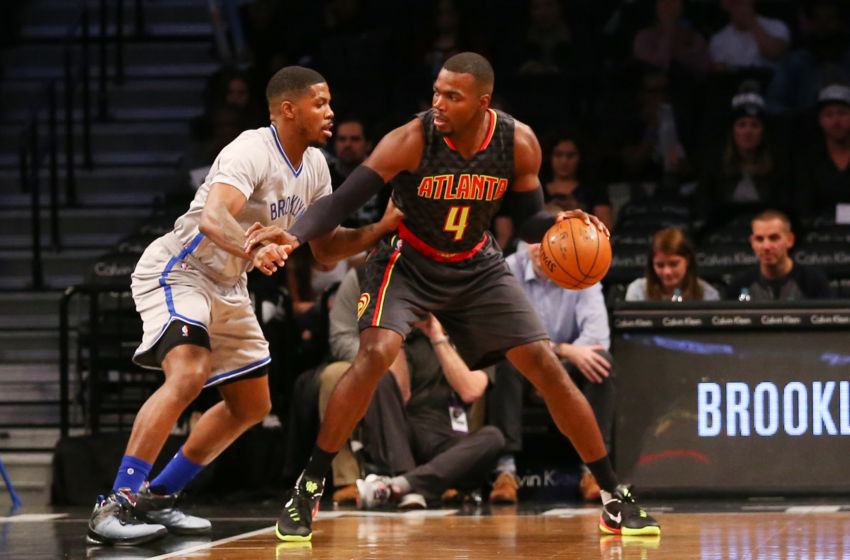 Nov 17, 2015; Brooklyn, NY, USA; Atlanta Hawks forward Paul Millsap (4) dribbles the ball as Brooklyn Nets forward Joe Johnson (7) defends during the first quarter at Barclays Center. Mandatory Credit: Anthony Gruppuso-USA TODAY Sports