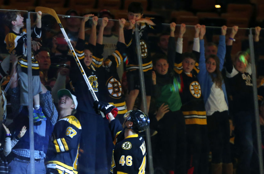 Stanley Cup Playoffs: After being named the first star of the game and scoring the winning goal, Boston Bruins center David Krejci (46) hands an autographed stick to a young fan after the Boston Bruins 4-3 win over the New York Rangers at TD Garden. Mandatory Credit: Winslow Townson-USA TODAY Sports