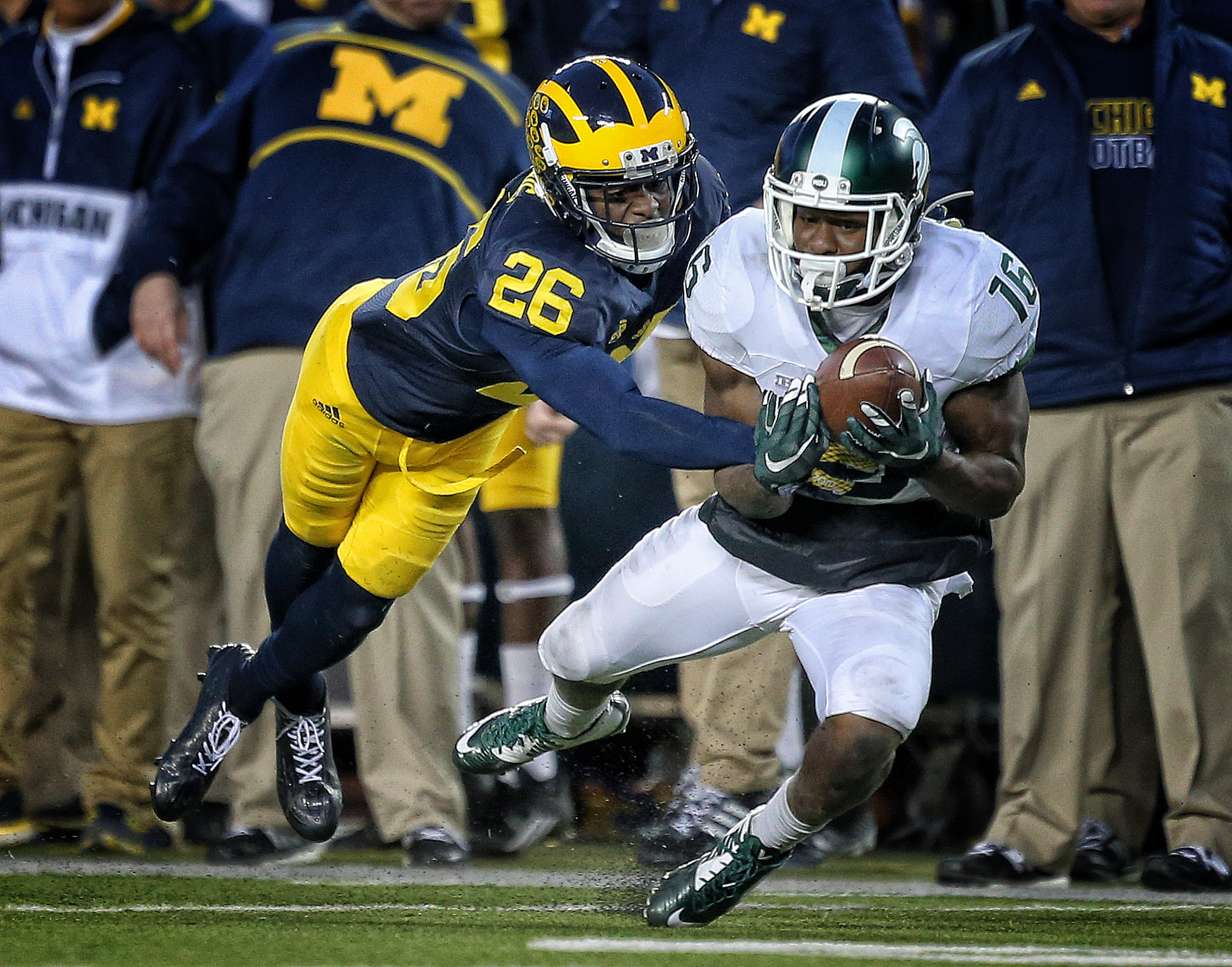Oct 17, 2015; Ann Arbor, MI, USA; Michigan Wolverines cornerback Jourdan Lewis (26) defends against Michigan State Spartans wide receiver Aaron Burbridge (16) during the 2nd half of a game at Michigan Stadium. Mandatory Credit: Mike Carter-USA TODAY Sports