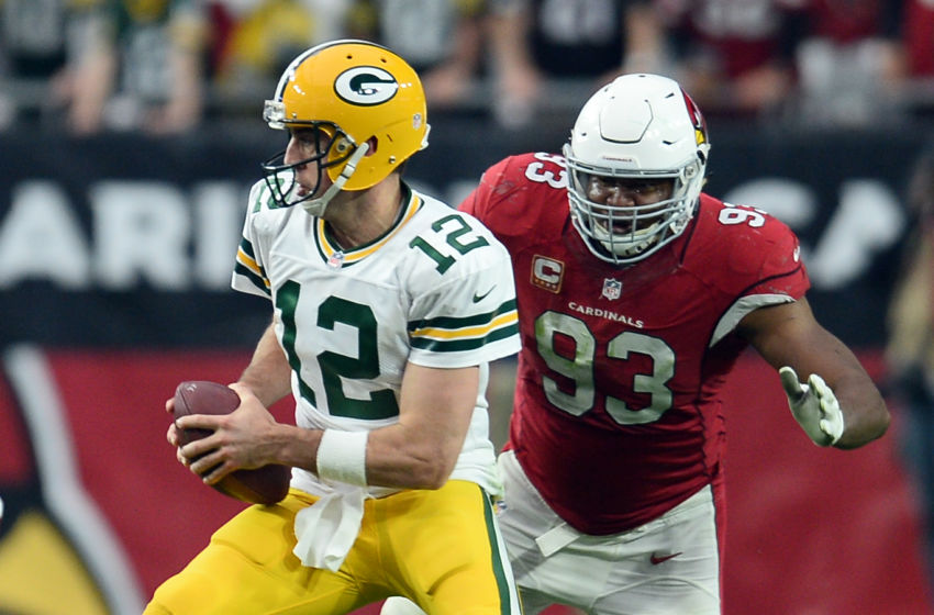 Dec 27, 2015; Glendale, AZ, USA; Arizona Cardinals defensive end Calais Campbell (93) pursues Green Bay Packers quarterback Aaron Rodgers (12) during the first half at University of Phoenix Stadium. Mandatory Credit: Joe Camporeale-USA TODAY Sports