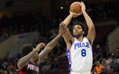 Jan 16, 2016; Philadelphia, PA, USA; Philadelphia 76ers center Jahlil Okafor (8) scores past Portland Trail Blazers center Ed Davis (17) during the first quarter at Wells Fargo Center. Mandatory Credit: Bill Streicher-USA TODAY Sports