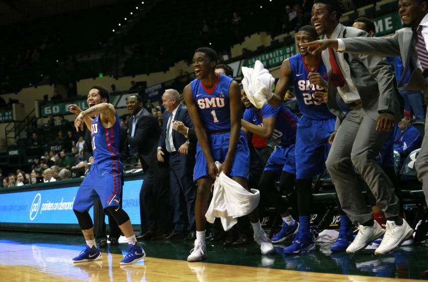 Feb 7, 2016; Tampa, FL, USA; Southern Methodist Mustangs guard Nic Moore (11) and guard Shake Milton (1) and the bench celebrates after a Mustangs basket during the second half against the South Florida Bulls at USF Sun Dome. SMU defeated South Florida 93-59. Mandatory Credit: Kim Klement-USA TODAY Sports
