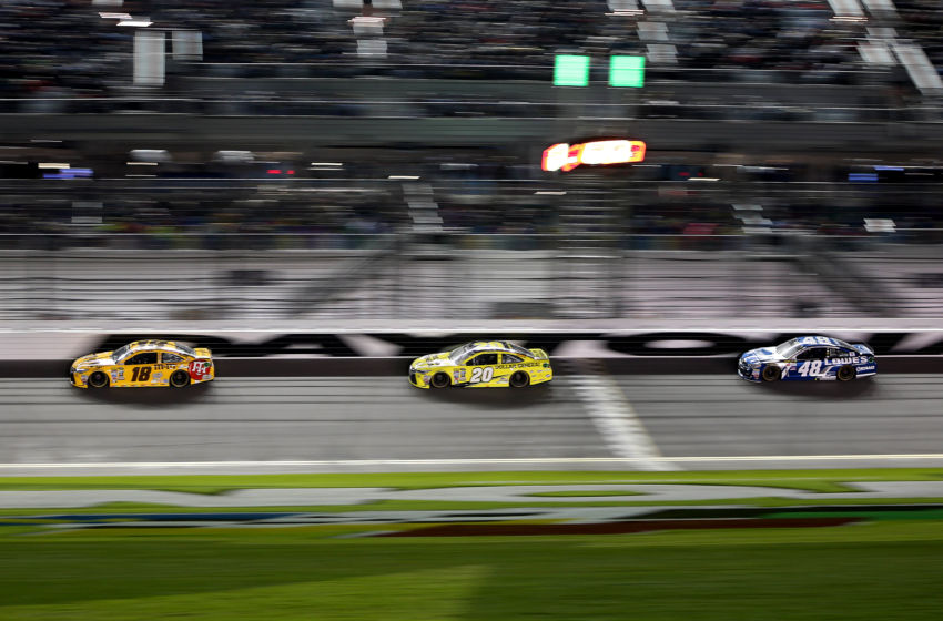 Feb 18, 2016; Daytona Beach, FL, USA; NASCAR Sprint Cup Series driver Kyle Busch (18), NASCAR Sprint Cup Series driver Matt Kenseth (20) and NASCAR Sprint Cup Series driver Jimmie Johnson (48) during the Cam-Am Duels at Daytona race two at Daytona International Speedway. Mandatory Credit: Peter Casey-USA TODAY Sports