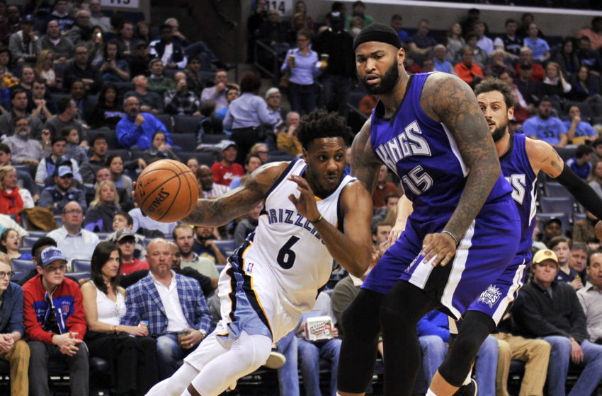 Mar 2, 2016; Memphis, TN, USA; Memphis Grizzlies guard Mario Chalmers (6) drives to the basket against Sacramento Kings center DeMarcus Cousins (15) during the first half at FedExForum. Mandatory Credit: Justin Ford-USA TODAY Sports