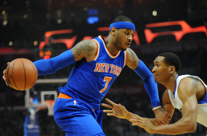 March 11, 2016; Los Angeles, CA, USA; New York Knicks forward Carmelo Anthony (7) moves the ball against Los Angeles Clippers forward Wesley Johnson (33) during the first half at Staples Center. Mandatory Credit: Gary A. Vasquez-USA TODAY Sports