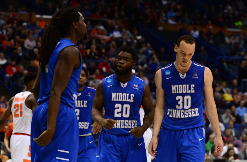Mar 20, 2016; St. Louis, MO, USA; Middle Tennessee Blue Raiders forward Reggie Upshaw (30), guard Giddy Potts (20) and forward Darnell Harris (0) react during the second half of the second round against the Syracuse Orange in the 2016 NCAA Tournament at Scottrade Center. Mandatory Credit: Jeff Curry-USA TODAY Sports