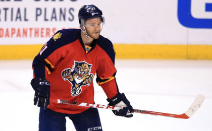 Mar 31, 2016; Sunrise, FL, USA; Florida Panthers center Jonathan Huberdeau (11) looks for the puck in the third period of a game against the New Jersey Devils at BB&T Center. The Panthers won 3-2. Mandatory Credit: Robert Mayer-USA TODAY Sports