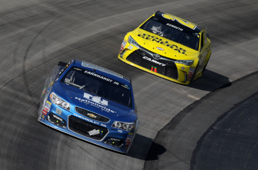 May 15, 2016; Dover, DE, USA; NASCAR Sprint Cup Series driver Dale Earnhardt Jr (88) leads driver Matt Kenseth (20) during the AAA 400 Drive For Autism at Dover International Speedway. Mandatory Credit: Matthew O'Haren-USA TODAY Sports