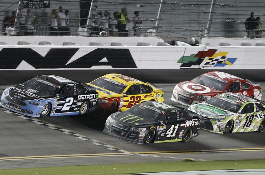 Jul 2, 2016; Daytona Beach, FL, USA; NASCAR Sprint Cup Series driver Brad Keselowski (2), driver Kyle Larson (42), driver Joey Logano (22), driver Kyle Busch (18), and driver Kyle Larson (42) cross the restart line with three laps to go during the Coke Zero 400 at Daytona International Speedway. Mandatory Credit: Reinhold Matay-USA TODAY Sports