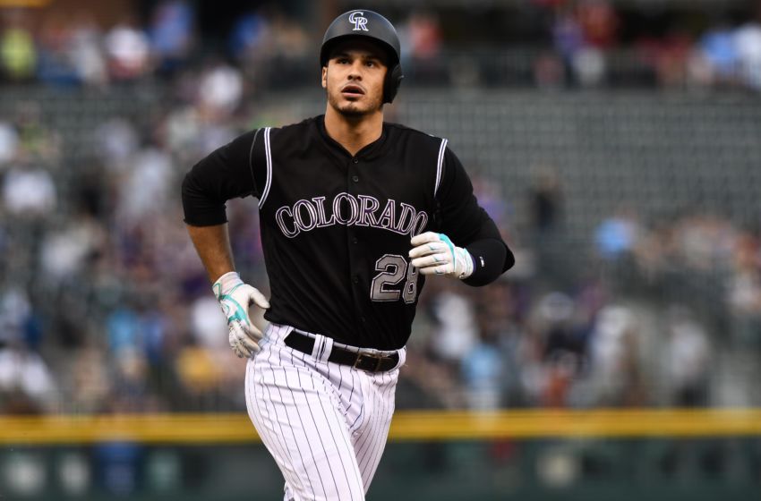 Aug 3, 2016; Denver, CO, USA; Colorado Rockies third baseman Nolan Arenado (28) heads home after hitting a three run home run in the first inning against the Los Angeles Dodgers at Coors Field. Mandatory Credit: Ron Chenoy-USA TODAY Sports