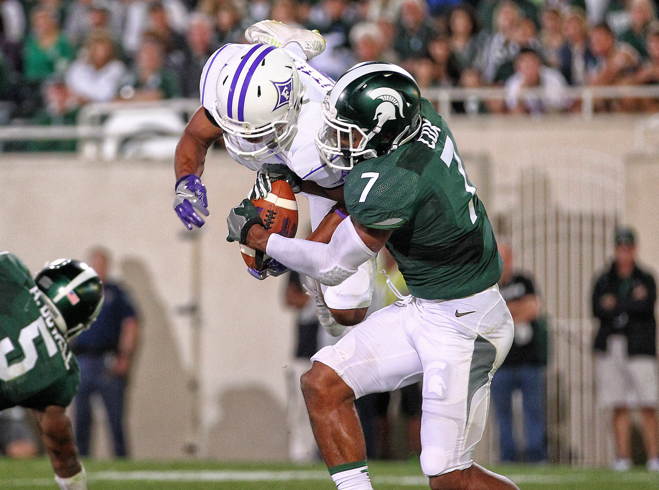 Sep 2, 2016; East Lansing, MI, USA; Michigan State Spartans defensive back Demetrious Cox (7) block a pass intended for Furman Paladins wide receiver Andrej Suttles (3) during the second half of a game at Spartan Stadium. Mandatory Credit: Mike Carter-USA TODAY Sports