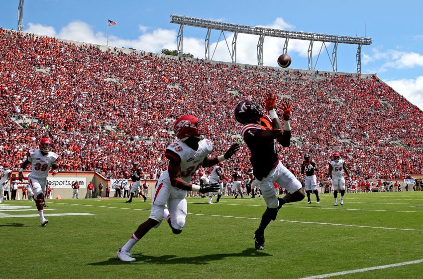 Sep 3, 2016; Blacksburg, VA, USA; Virginia Tech Hokies wide receiver Isaiah Ford (1) catches a touchdown pass against Liberty Flames cornerback Chris Turner (39) during the first quarter at Lane Stadium. Mandatory Credit: Peter Casey-USA TODAY Sports