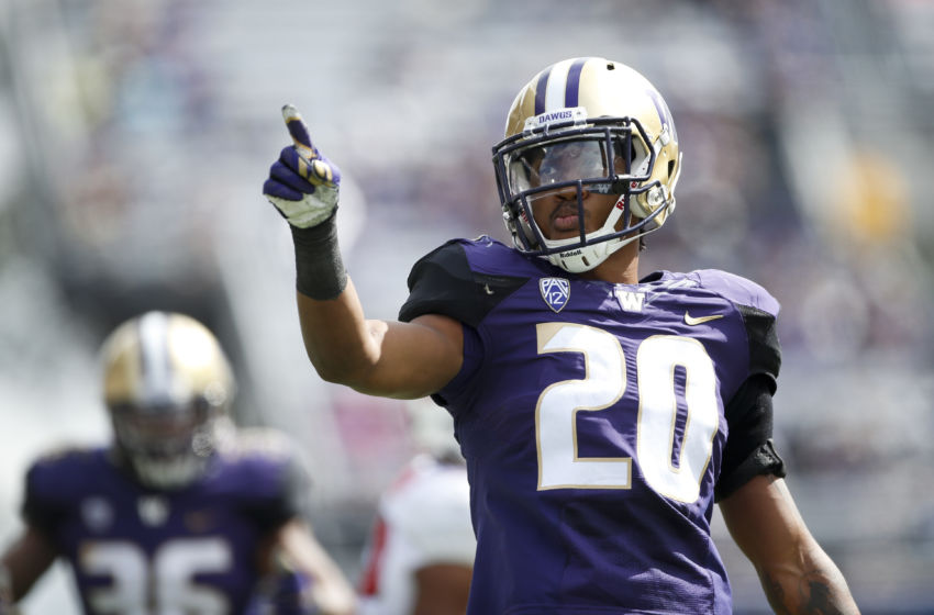 Sep 3, 2016; Seattle, WA, USA; Washington Huskies defensive back Kevin King (20) points to the stands after making a tackle for a loss against the Rutgers Scarlet Knights during the second quarter at Husky Stadium. Mandatory Credit: Jennifer Buchanan-USA TODAY Sports