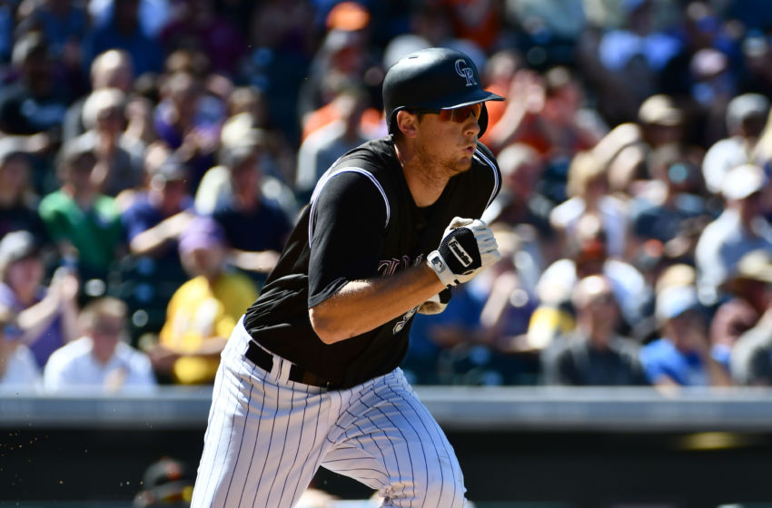 Sep 5, 2016; Denver, CO, USA; Colorado Rockies second baseman DJ LeMahieu (9) runs out a single in the first inning against the San Francisco Giants at Coors Field. Mandatory Credit: Ron Chenoy-USA TODAY Sports