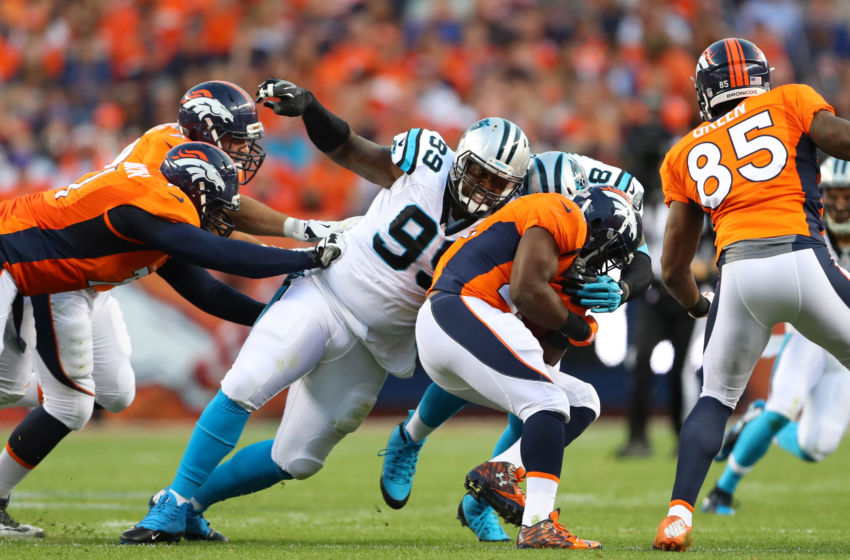 Sep 8, 2016; Denver, CO, USA; Carolina Panthers defensive tackle Kawann Short (99) tackles Denver Broncos running back C.J. Anderson in the first quarter at Sports Authority Field at Mile High. Mandatory Credit: Mark J. Rebilas-USA TODAY Sports