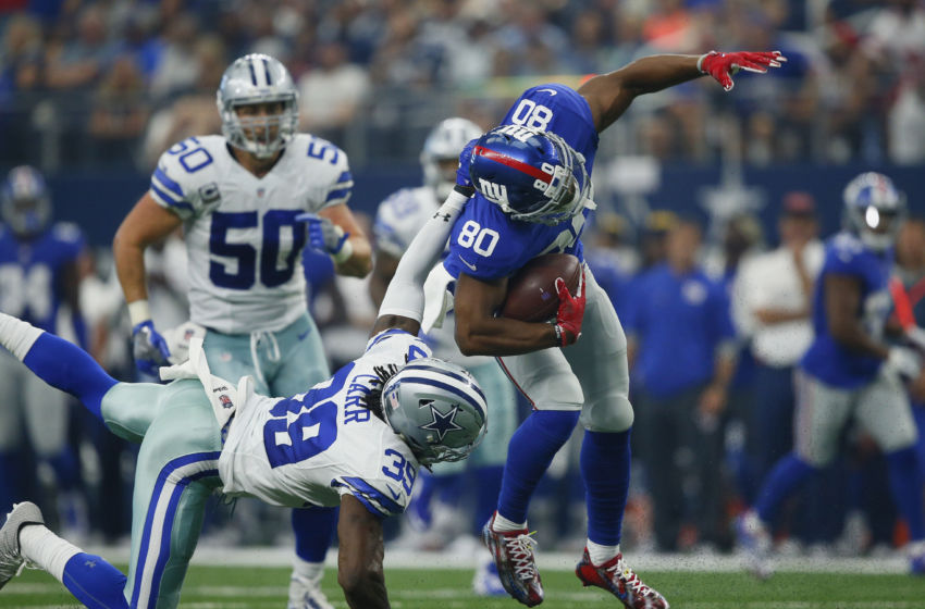 Sep 11, 2016; Arlington, TX, USA; Dallas Cowboys cornerback Brandon Carr (39) takes down New York Giants wide receiver Victor Cruz (80) at AT&T Stadium. Mandatory Credit: Erich Schlegel-USA TODAY Sports