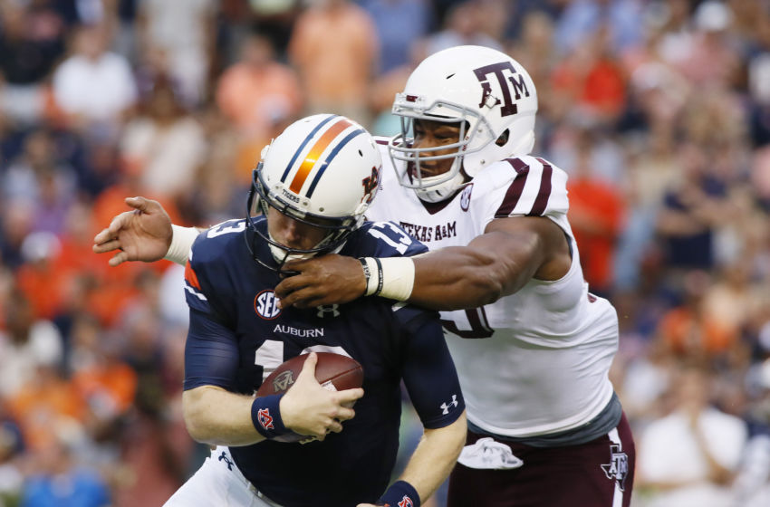 Sep 17, 2016; Auburn, AL, USA; Texas A&M Aggies lineman Myles Garrett (15) tackles Auburn Tigers quarterback Sean White (13) during the first quarter at Jordan Hare Stadium. Mandatory Credit: John Reed-USA TODAY Sports