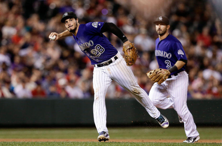 Sep 19, 2016; Denver, CO, USA; Colorado Rockies third baseman Nolan Arenado (28) fields the ball in the sixth inning against the St. Louis Cardinals at Coors Field. Mandatory Credit: Isaiah J. Downing-USA TODAY Sports