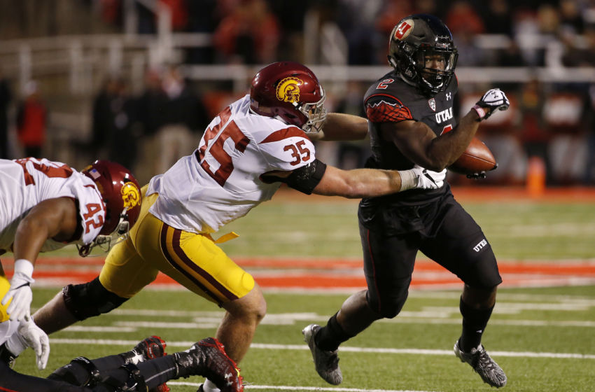 Sep 23, 2016; Salt Lake City, UT, USA; Utah Utes running back Zack Moss (2) runs the ball in the first quarter against USC Trojans linebacker Cameron Smith (35) at Rice-Eccles Stadium. Mandatory Credit: Jeff Swinger-USA TODAY Sports