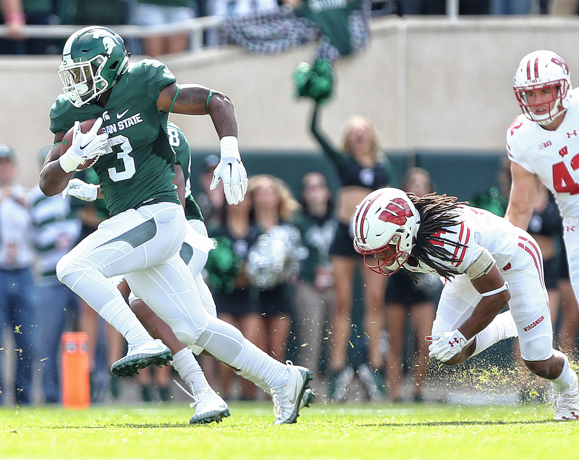 Sep 24, 2016; East Lansing, MI, USA; Michigan State Spartans running back LJ Scott (3) runs the ball during the first quarter of a game against the Wisconsin Badgers at Spartan Stadium. Mandatory Credit: Mike Carter-USA TODAY Sports