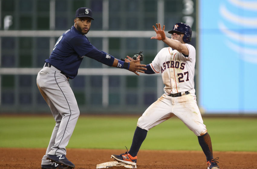 Sep 26, 2016; Houston, TX, USA; Houston Astros second baseman Jose Altuve (27) calls for time out after stealing a base during the ninth inning as Seattle Mariners second baseman Robinson Cano (22) attempts to apply a tag at Minute Maid Park. Mandatory Credit: Troy Taormina-USA TODAY Sports