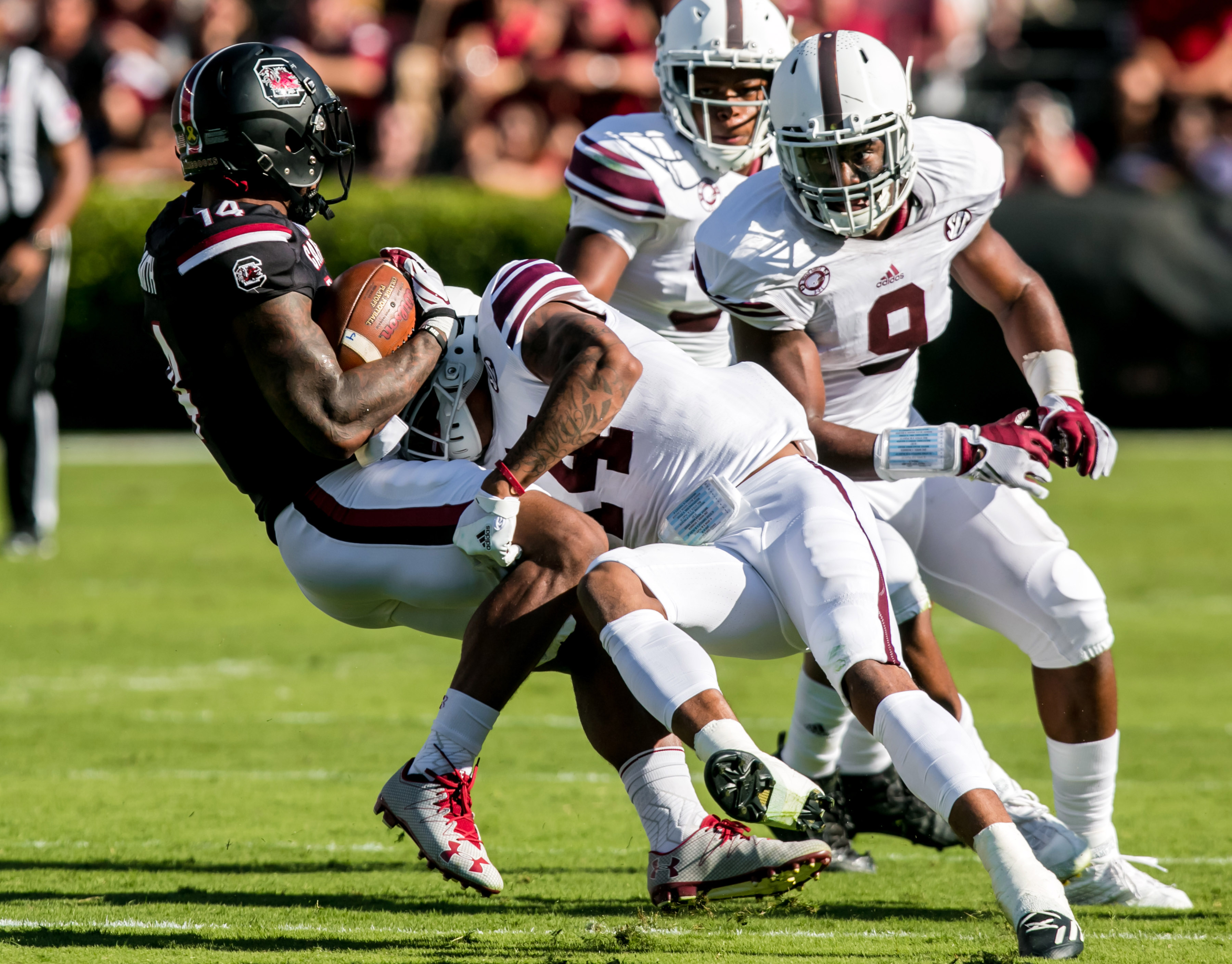 Oct 1, 2016; Columbia, SC, USA; South Carolina Gamecocks wide receiver Jamari Smith (14) is brought down by Texas A&M Aggies defensive back Justin Evans (14) at Williams-Brice Stadium. Mandatory Credit: Jeff Blake-USA TODAY Sports