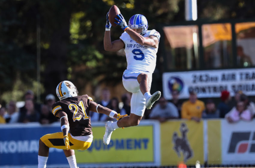 Oct 8, 2016; Laramie, WY, USA; Air Force Falcons wide receiver Jalen Robinette (9) makes a catch against Wyoming Cowboys cornerback Antonio Hull (21) during the third quarter at War Memorial Stadium. The Cowboys beat the Falcons 35-26. Mandatory Credit: Troy Babbitt-USA TODAY Sports