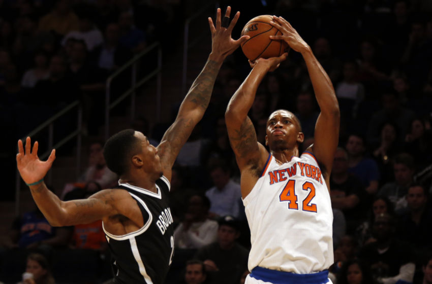 Oct 8, 2016; New York, NY, USA; New York Knicks forward Lance Thomas (42) shoots over Brooklyn Nets guard Rondae Hollis-Jefferson (24) during the first half at Madison Square Garden. Mandatory Credit: Adam Hunger-USA TODAY Sports