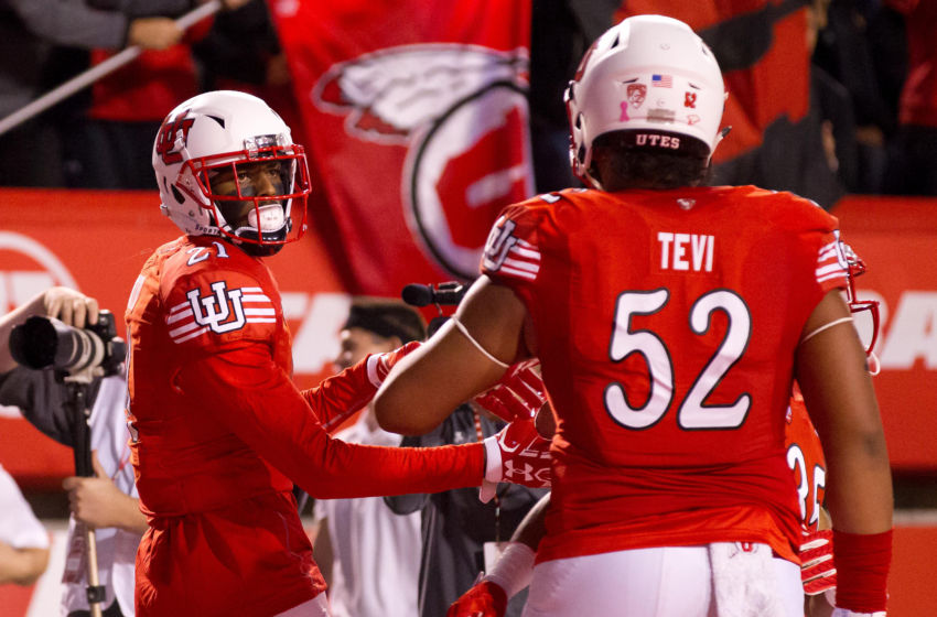 Oct 8, 2016; Salt Lake City, UT, USA; Utah Utes wide receiver Tyrone Smith (Left) and offensive tackle Sam Tevi (52) react to a touchdown by Smith during the first half against the Arizona Wildcats at Rice-Eccles Stadium. Mandatory Credit: Russ Isabella-USA TODAY Sports