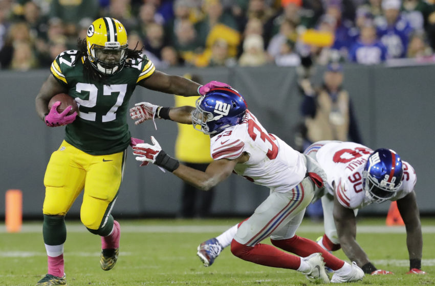 Oct 9, 2016; Green Bay, WI, USA; Green Bay Packers running back Eddie Lacy runs for a first down against New York Giants defender Andrew Adams in the second quarter at Lambeau Field. Mandatory Credit: Dan Powers/The Post-Crescent via USA TODAY Sports
