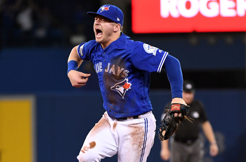 Oct 18, 2016; Toronto, Ontario, CAN; Toronto Blue Jays third baseman Josh Donaldson (20) reacts after making a play during the fifth inning against the Cleveland Indians in game four of the 2016 ALCS playoff baseball series at Rogers Centre. Mandatory Credit: Nick Turchiaro-USA TODAY Sports