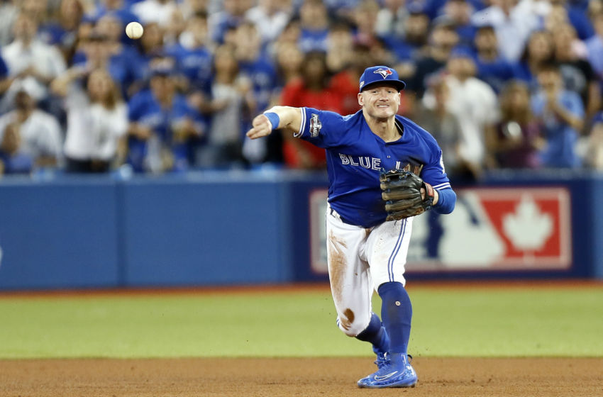 Oct 18, 2016; Toronto, Ontario, CAN; Toronto Blue Jays third baseman Josh Donaldson (20) throws to first base for an out during the fifth inning against the Cleveland Indians in game four of the 2016 ALCS playoff baseball series at Rogers Centre. Mandatory Credit: John E. Sokolowski-USA TODAY Sports