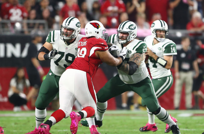 Oct 17, 2016; Glendale, AZ, USA; New York Jets offensive lineman Brent Qvale (79) and guard Brian Winters (67) block Arizona Cardinals defensive tackle Corey Peters at University of Phoenix Stadium. The Cardinals defeated the Jets 28-3. Mandatory Credit: Mark J. Rebilas-USA TODAY Sports