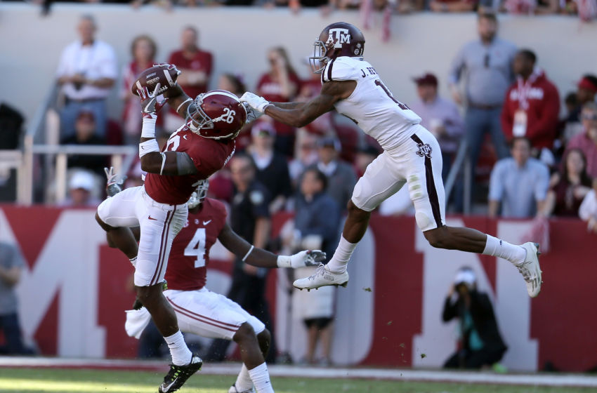 Oct 22, 2016; Tuscaloosa, AL, USA; Alabama Crimson Tide defensive back Marlon Humphrey (26) intercepts the ball from Texas A&M Aggies wide receiver Josh Reynolds (11) at Bryant-Denny Stadium. Mandatory Credit: Marvin Gentry-USA TODAY Sports