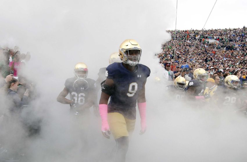 Oct 29, 2016; South Bend, IN, USA; Notre Dame Fighting Irish defensive lineman Daelin Hayes (9) runs onto the field before the game against the Miami Hurricanes at Notre Dame Stadium. Mandatory Credit: Brian Spurlock-USA TODAY Sports