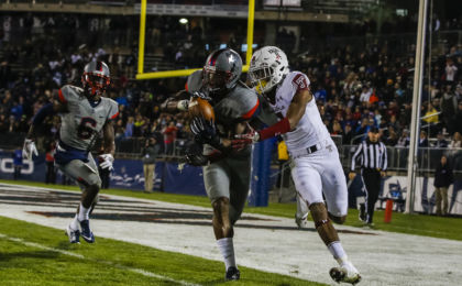 Nov 4, 2016; East Hartford, CT, USA; Connecticut Huskies safety Obi Melifonwu (20) intercepts a pass intended for Temple Owls wide receiver Ventell Bryant (1) in the second quarter at Pratt & Whitney Stadium at Rentschler Field. Mandatory Credit: David Butler II-USA TODAY Sports