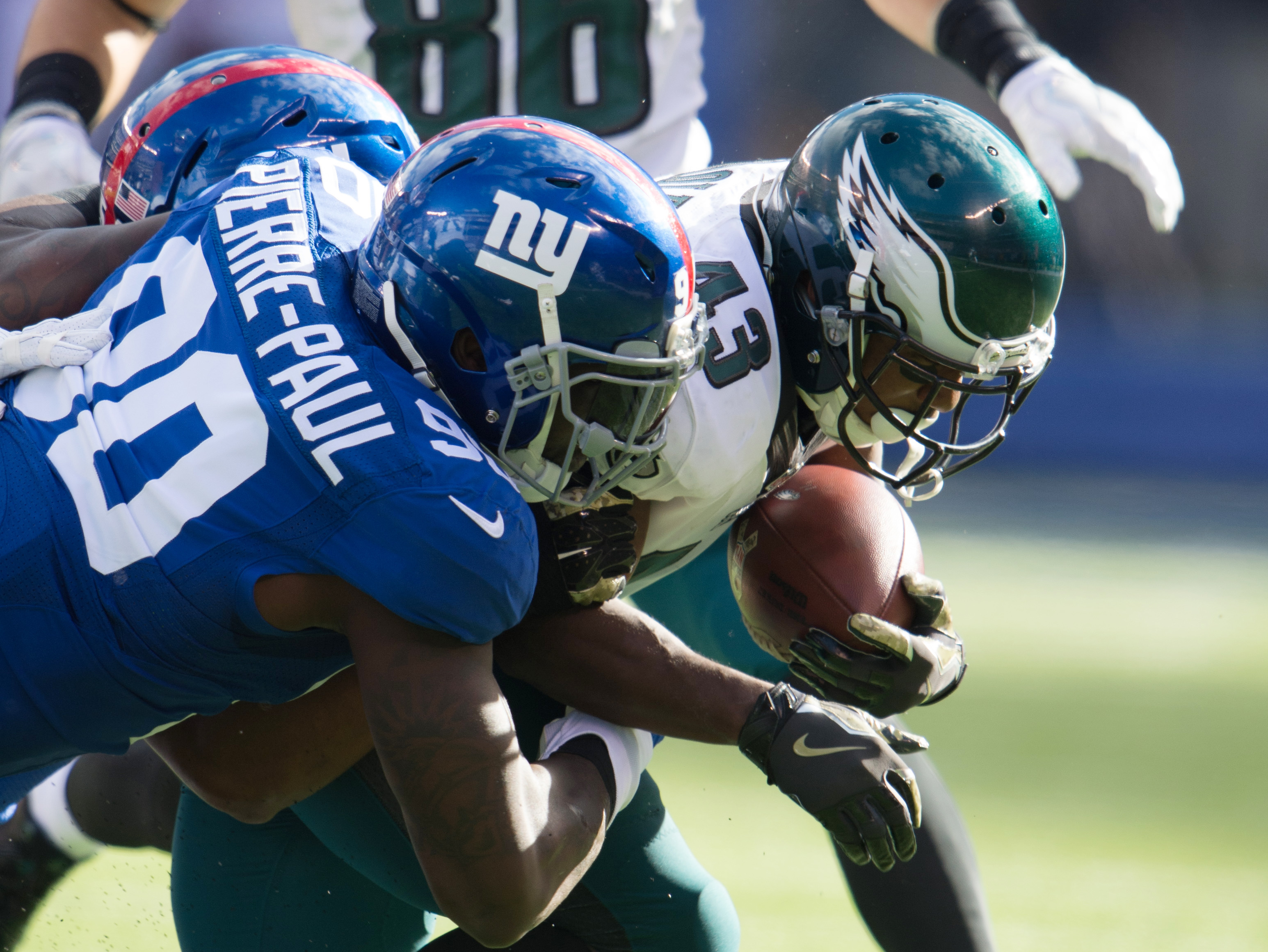 Nov 6, 2016; East Rutherford, NJ, USA; New York Giants defensive end Jason Pierre-Paul (90) tackles Philadelphia Eagles running back Darren Sproles (43) during the first half at MetLife Stadium. Mandatory Credit: William Hauser-USA TODAY Sports