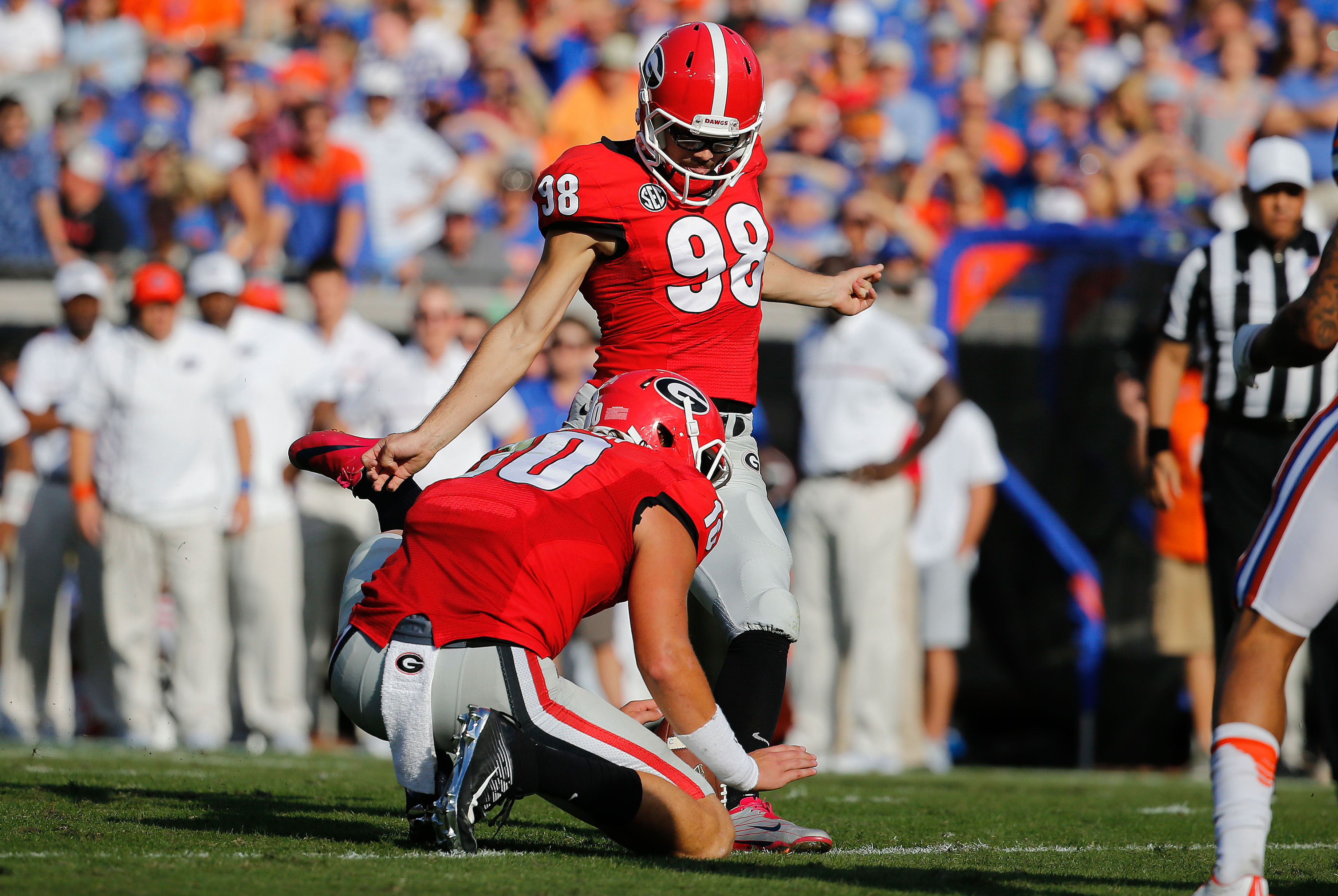 Oct 29, 2016; Jacksonville, FL, USA;Georgia Bulldogs place kicker Rodrigo Blankenship (98) kicks a field goal as Georgia Bulldogs quarterback Jacob Eason (10) holds the ball against the Florida Gators during the first half at EverBank Field. Mandatory Credit: Kim Klement-USA TODAY Sports