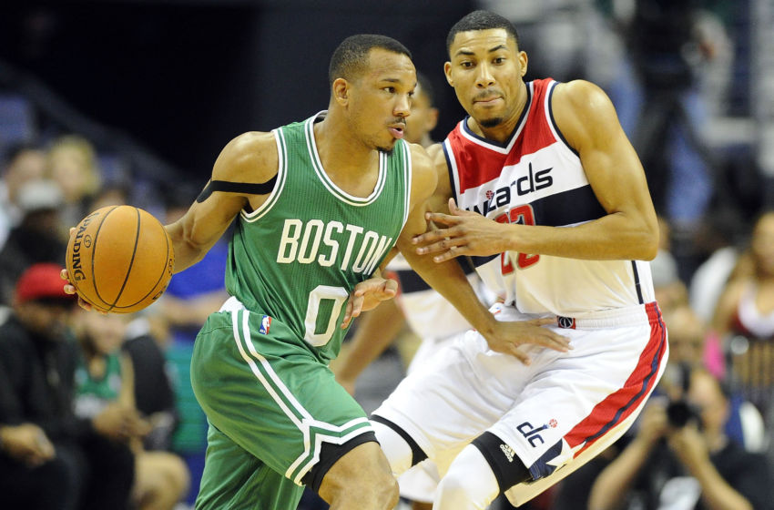 Nov 9, 2016; Washington, DC, USA; Boston Celtics guard Avery Bradley (0) dribbles as Washington Wizards forward Otto Porter Jr. (22) defends during the first half at Verizon Center. Mandatory Credit: Brad Mills-USA TODAY Sports