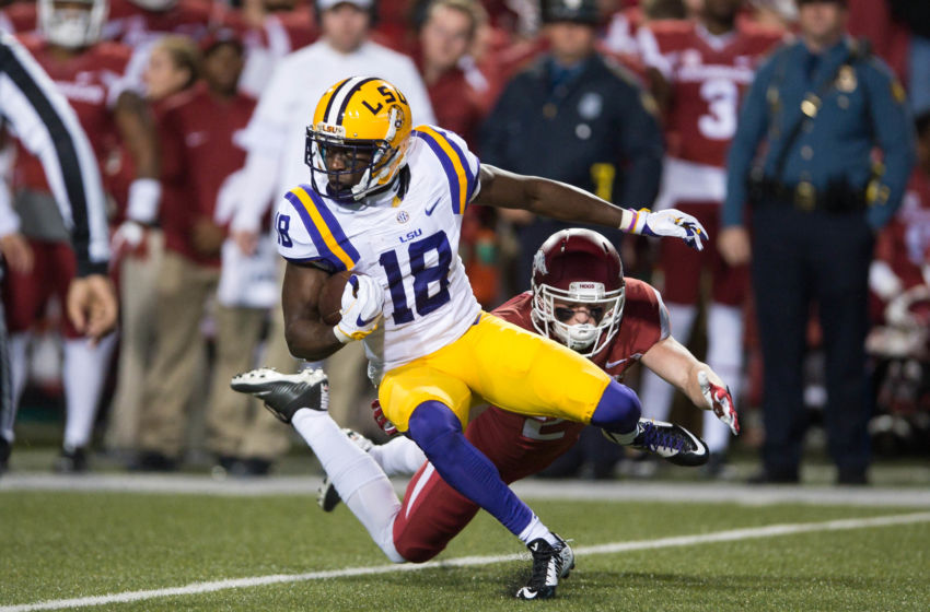 Nov 12, 2016; Fayetteville, AR, USA; LSU Tigers cornerback Tre'Davious White (18) is tackled by Arkansas Razorbacks defensive back Ryder Lucas (24) during the first quarter of the game at Donald W. Reynolds Razorback Stadium. Mandatory Credit: Brett Rojo-USA TODAY Sports